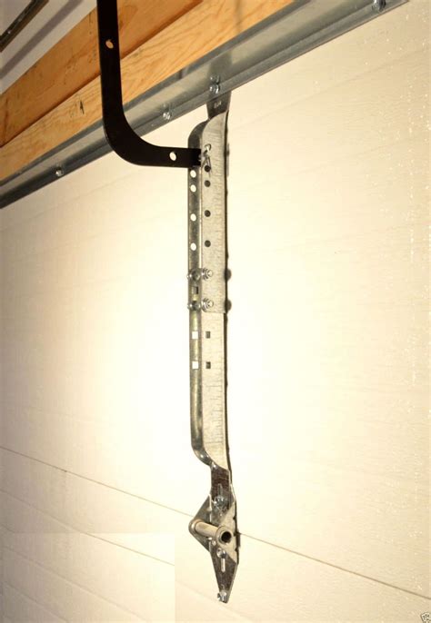 garage door opener arm bracket near metal|16' garage door reinforcement bracket.